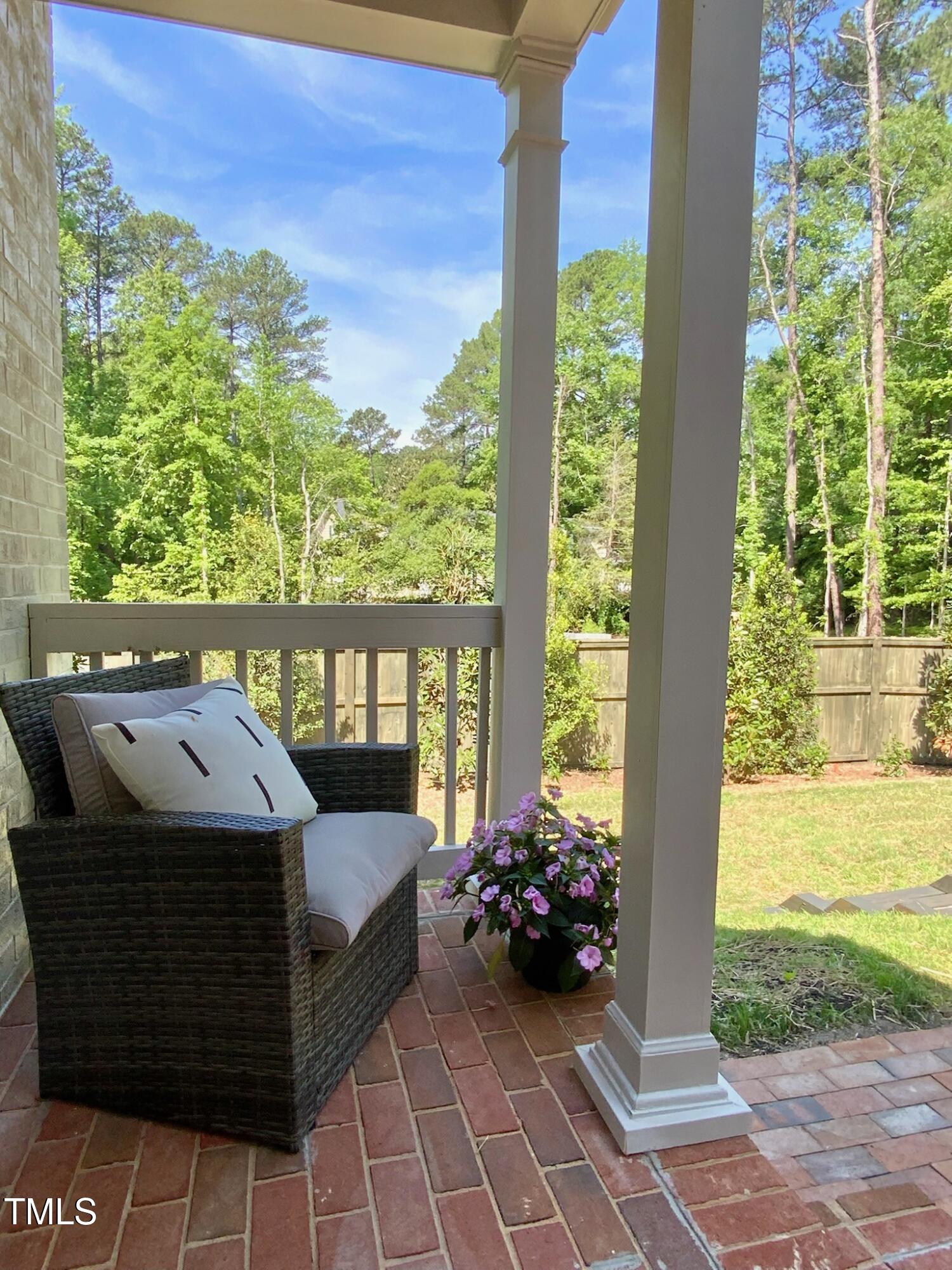 3838 Regent Road Durham, NC 27707 - Photo 10 of 55 a view of a patio with a table and chairs next to a yard
