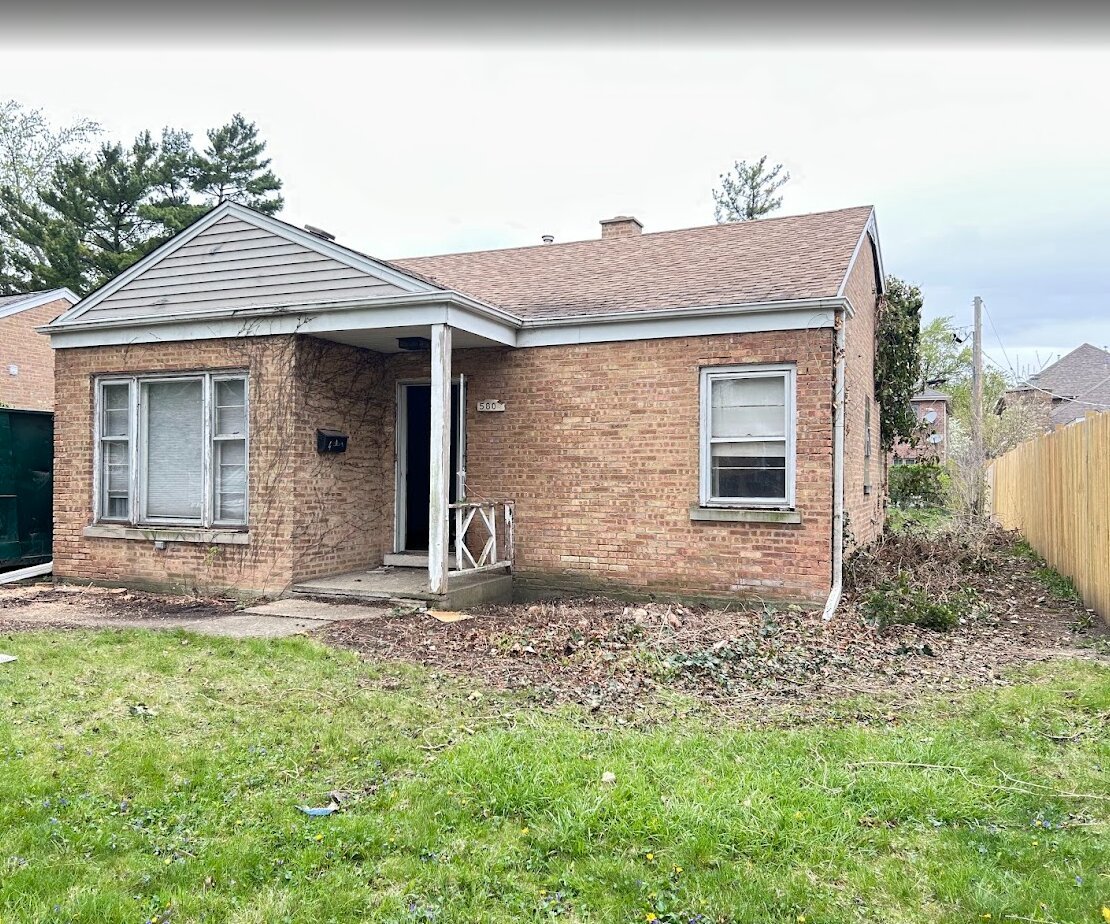 5804 Madison Street Morton Grove, IL 60053 - Photo 1 of 3 a front view of a house with garden