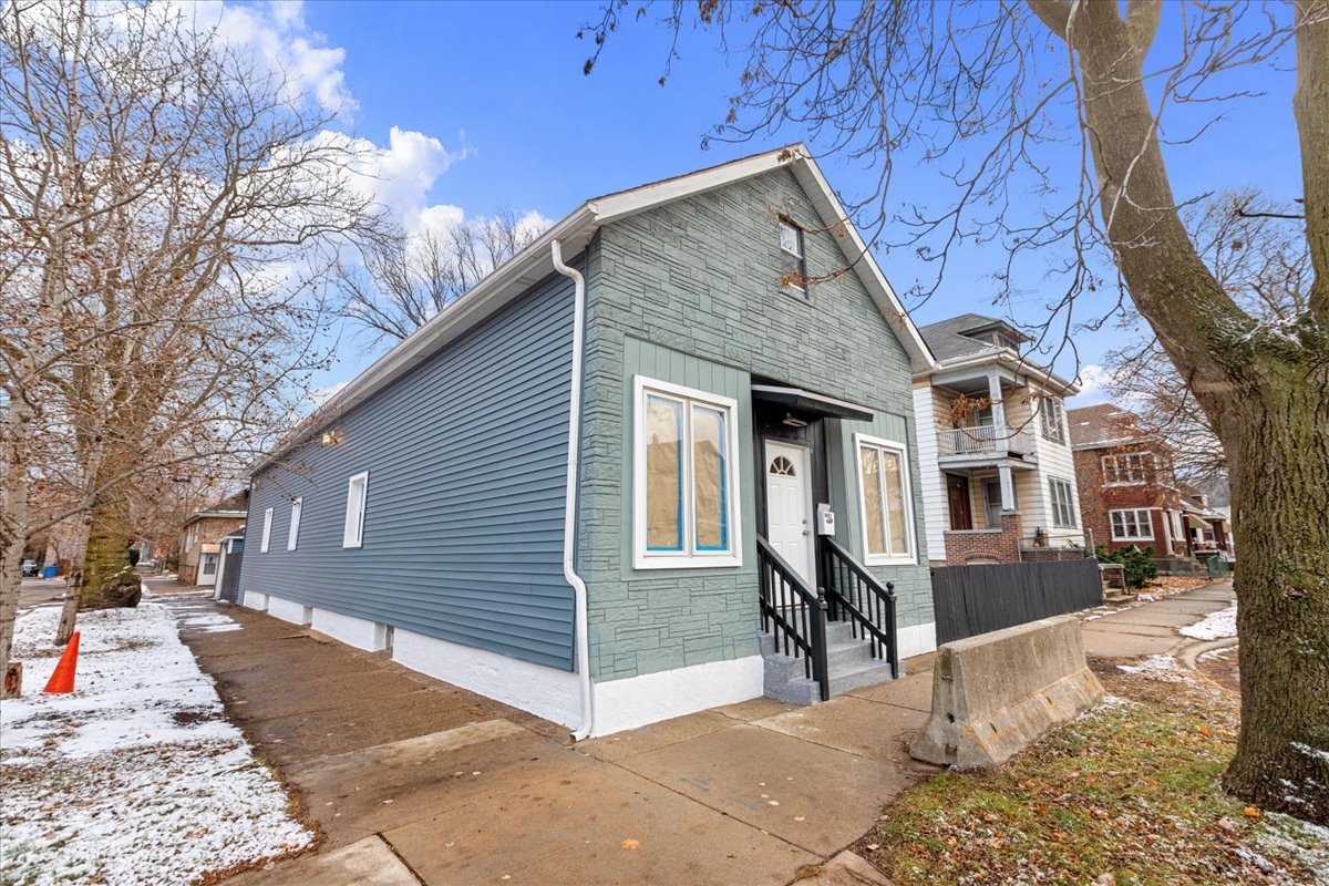 8601 South Houston Avenue Chicago, IL 60617 - Photo 1 of 1 a view of a house with a yard
