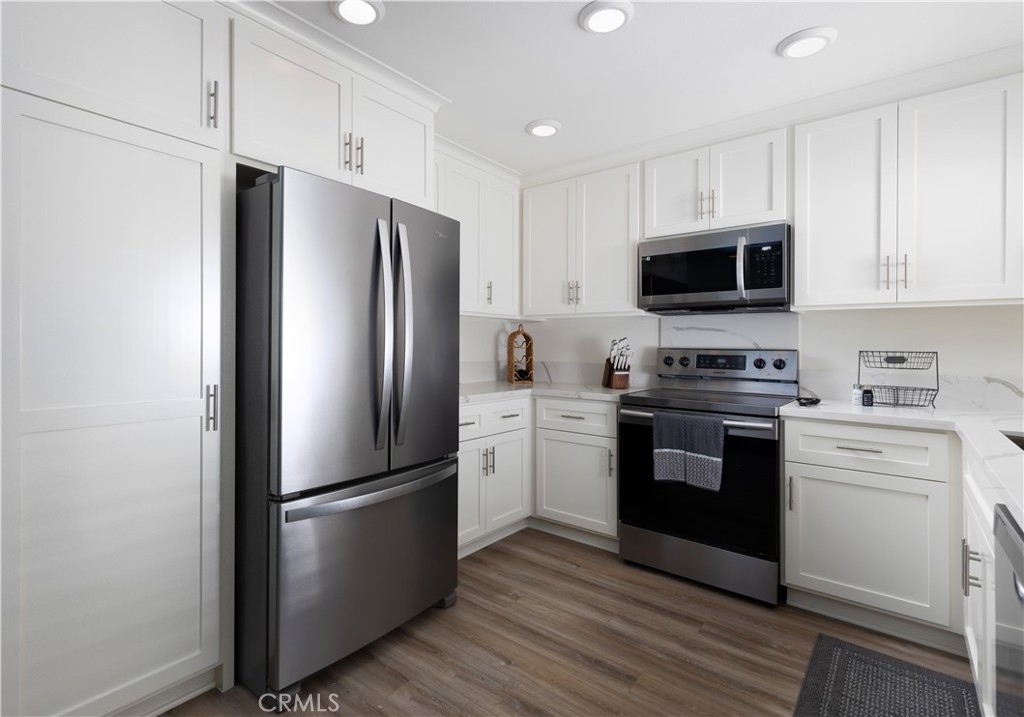 34116 Selva Road, Unit 308 Dana Point, CA 92629 - Photo 13 of 29 a kitchen with a refrigerator stove and microwave