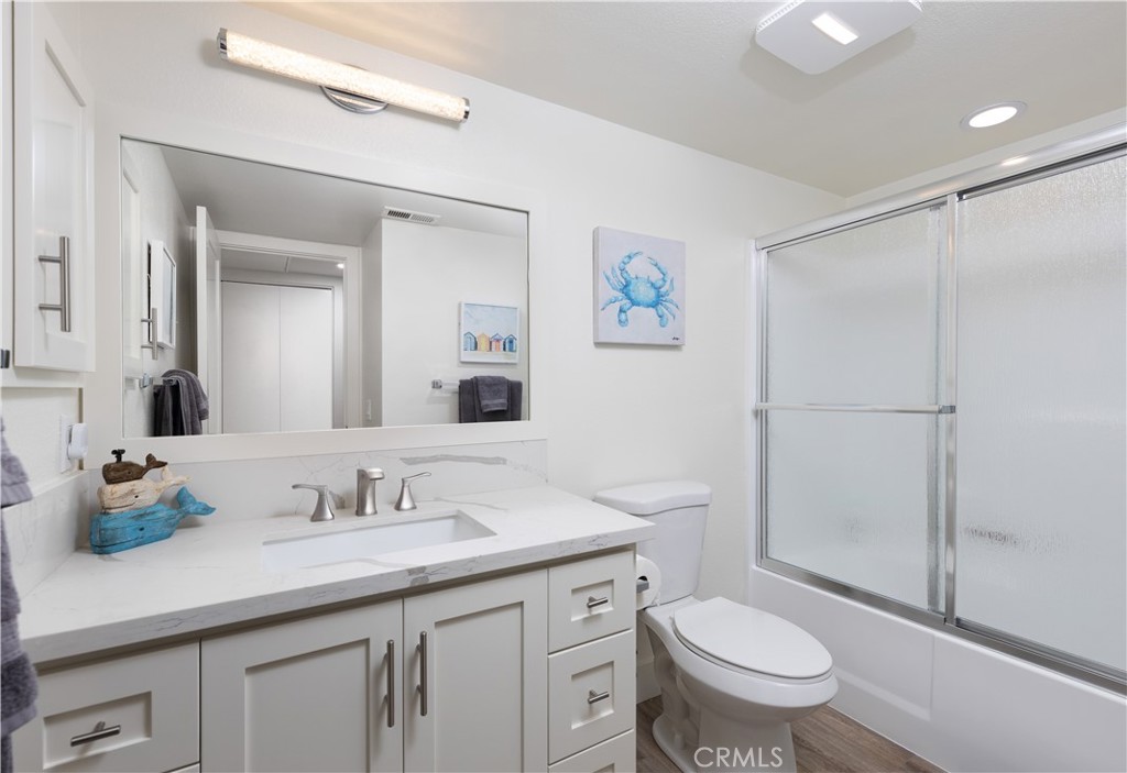 34116 Selva Road, Unit 308 Dana Point, CA 92629 - Photo 15 of 29 a bathroom with a granite countertop sink toilet and shower