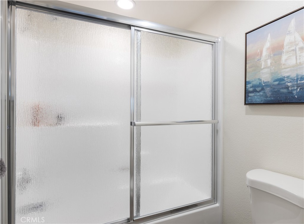 34116 Selva Road, Unit 308 Dana Point, CA 92629 - Photo 20 of 29 a bathroom with a shower and a toilet