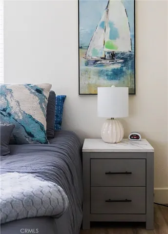 a bedroom with a bed and a mirror