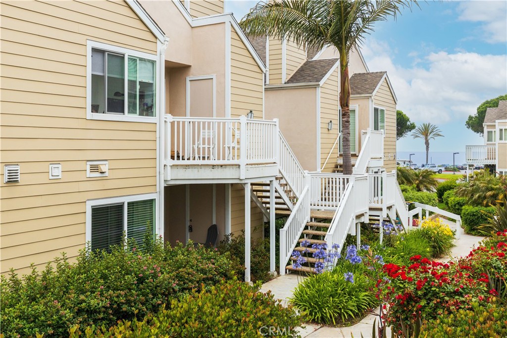 34116 Selva Road, Unit 308 Dana Point, CA 92629 - Photo 4 of 29 front view of a house with a yard
