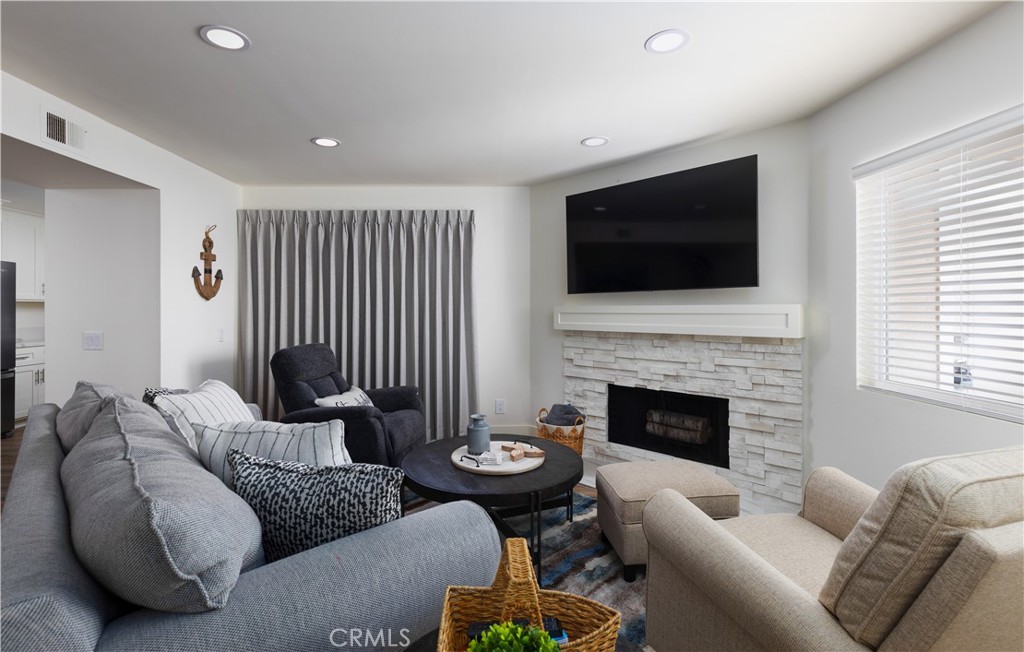 34116 Selva Road, Unit 308 Dana Point, CA 92629 - Photo 6 of 29 a living room with furniture or fireplace and a flat screen tv