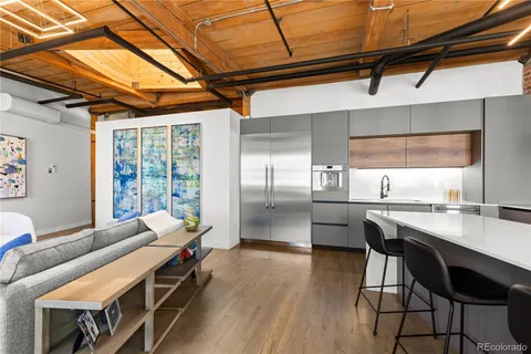a kitchen with stainless steel appliances granite countertop a stove and cabinets