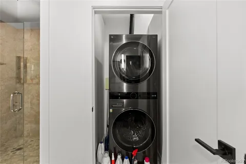 a close view of a utility room with dryer and washer