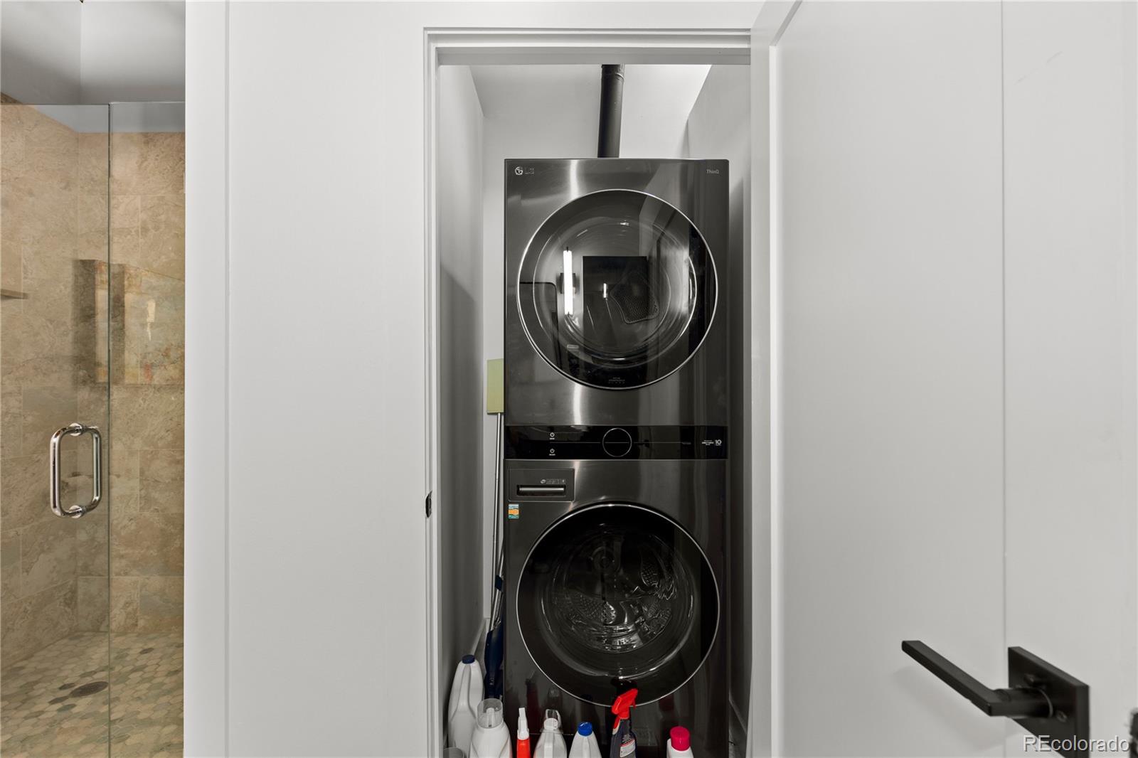 1616 14th Street, Unit 5B Denver, CO 80202 - Photo 16 of 26 a close view of a utility room with dryer and washer