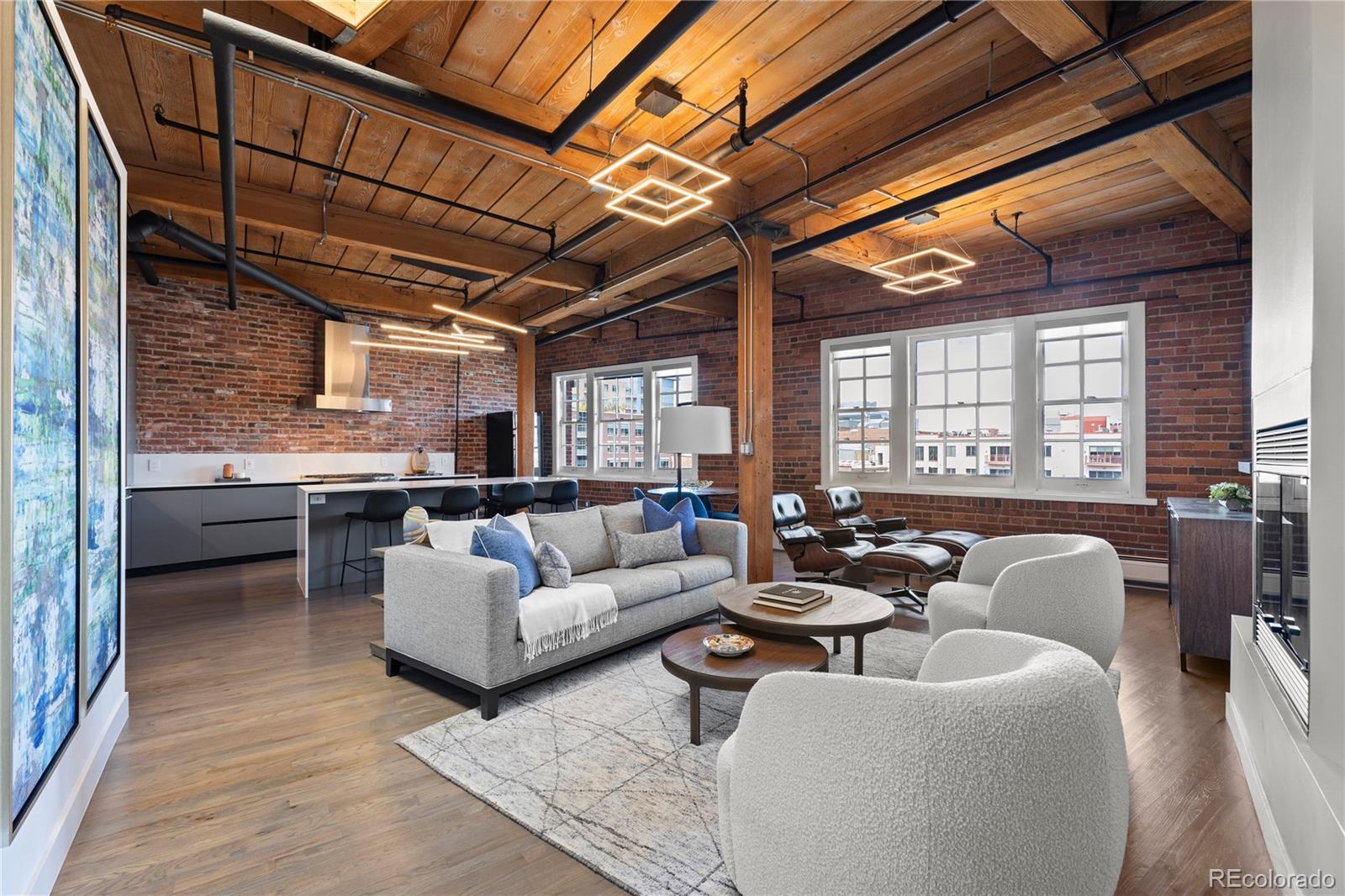 1616 14th Street, Unit 5B Denver, CO 80202 - Photo 2 of 26 a living room with furniture and a large window