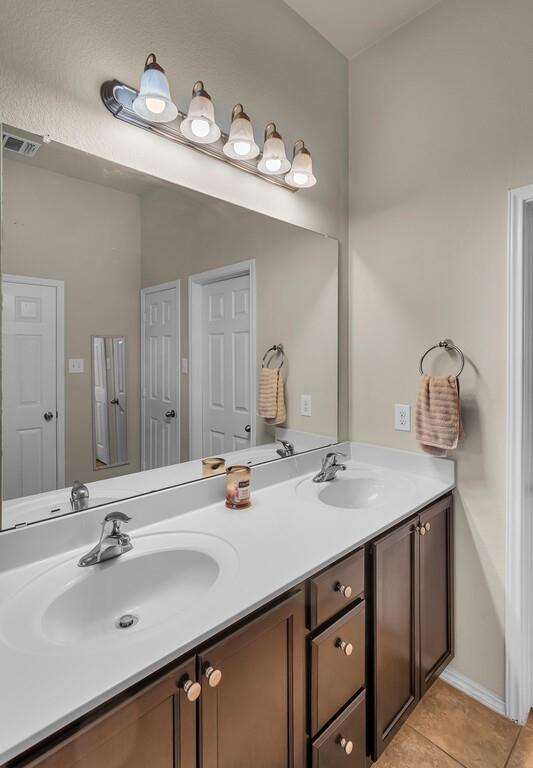 9801 Shallow Creek Drive Waco, TX 76708 - Photo 21 of 31 a bathroom with a sink double vanity and a mirror