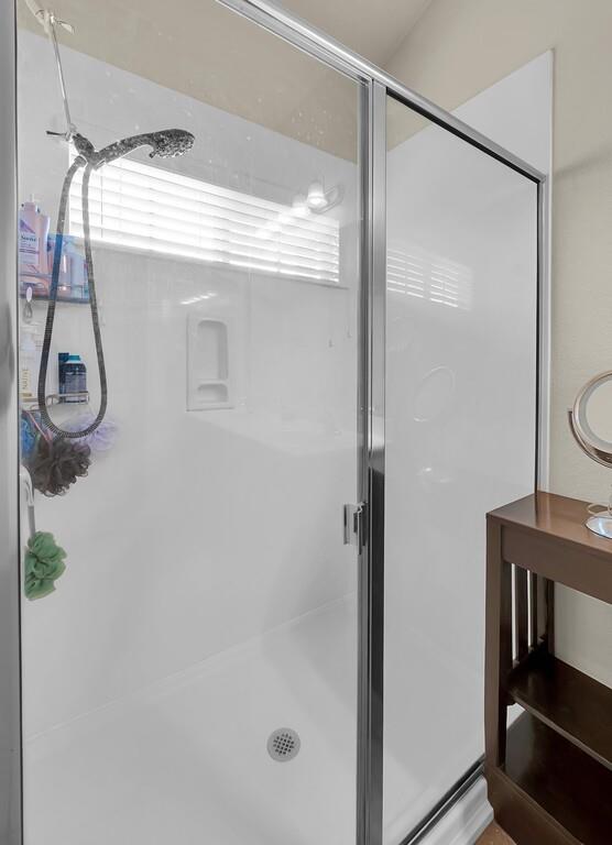 9801 Shallow Creek Drive Waco, TX 76708 - Photo 22 of 31 a bathroom with a glass shower door
