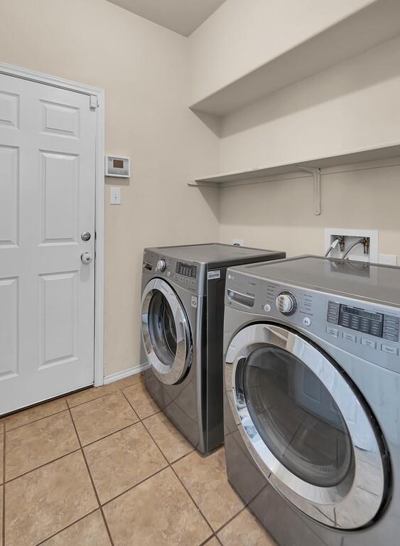 9801 Shallow Creek Drive Waco, TX 76708 - Photo 26 of 31 a utility room with dryer and washer