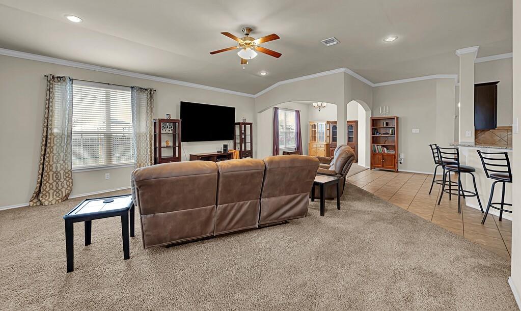 9801 Shallow Creek Drive Waco, TX 76708 - Photo 7 of 31 a bedroom with a bed and a chandelier