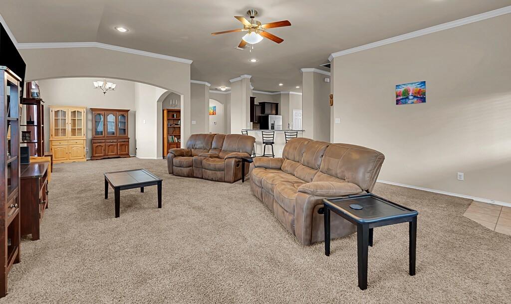 9801 Shallow Creek Drive Waco, TX 76708 - Photo 8 of 31 a living room with furniture and a chandelier