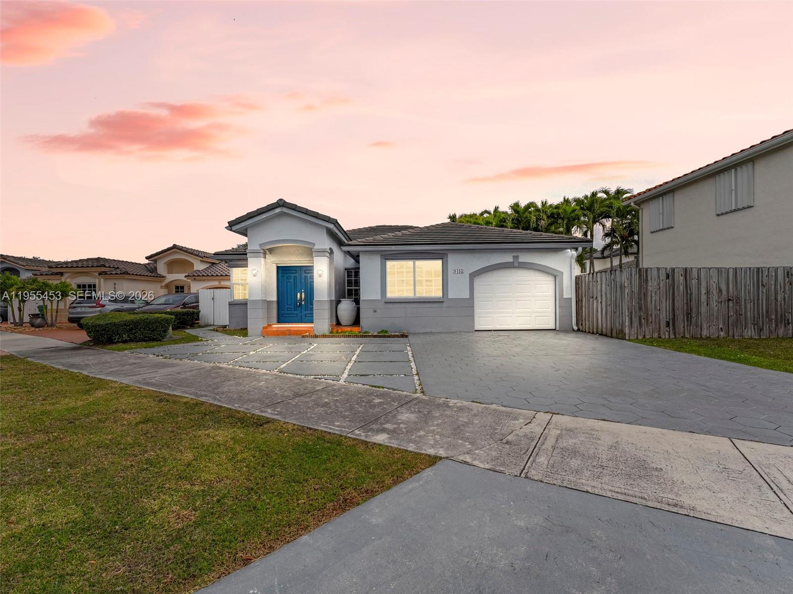 9435 Southwest 156th Place Miami, FL 33196 - Photo 1 of 45 a house view with a garden space