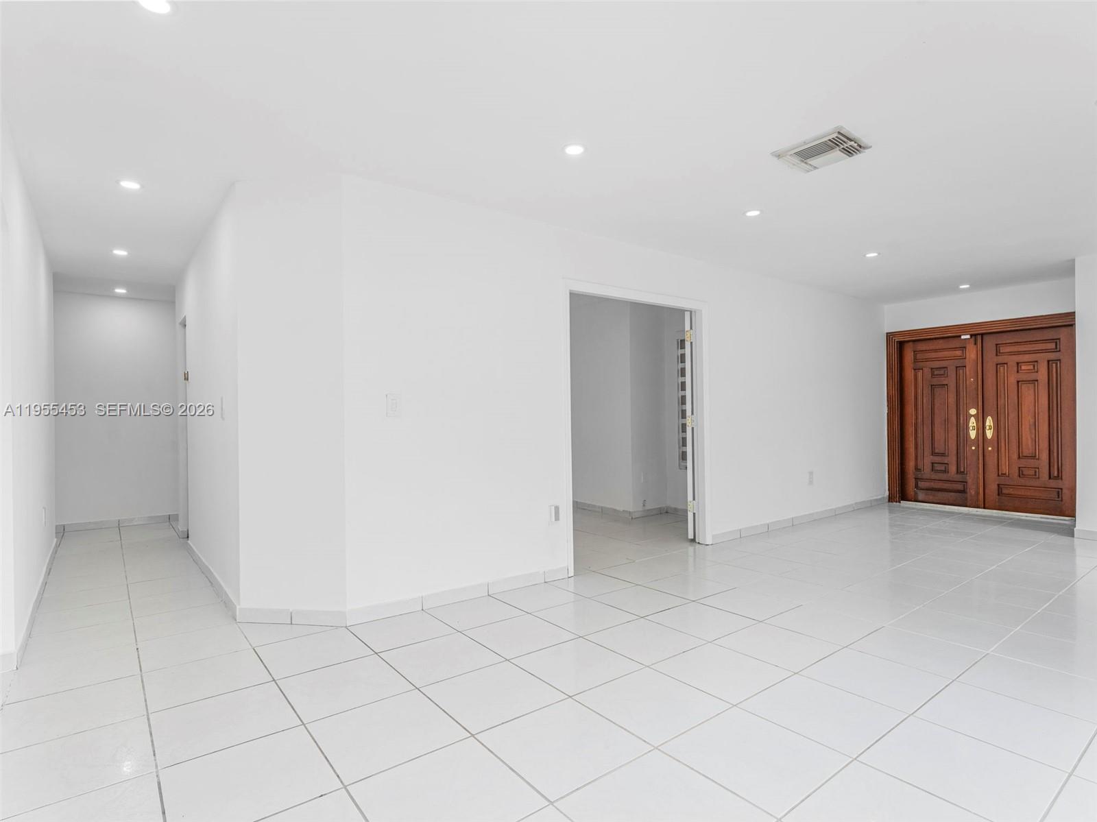 9435 Southwest 156th Place Miami, FL 33196 - Photo 15 of 45 an empty room with closet and windows