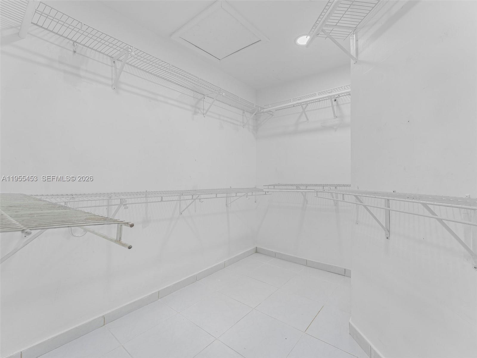 9435 Southwest 156th Place Miami, FL 33196 - Photo 17 of 45 a view of a room with racks on the wall