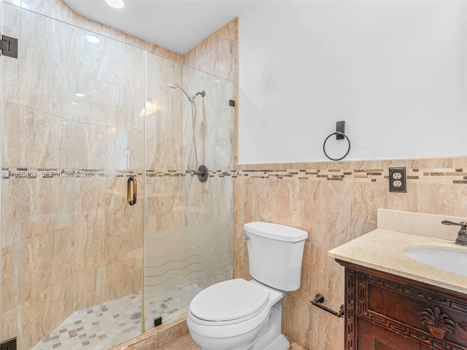 9435 Southwest 156th Place Miami, FL 33196 - Photo 20 of 45 a bathroom with a sink a toilet and shower