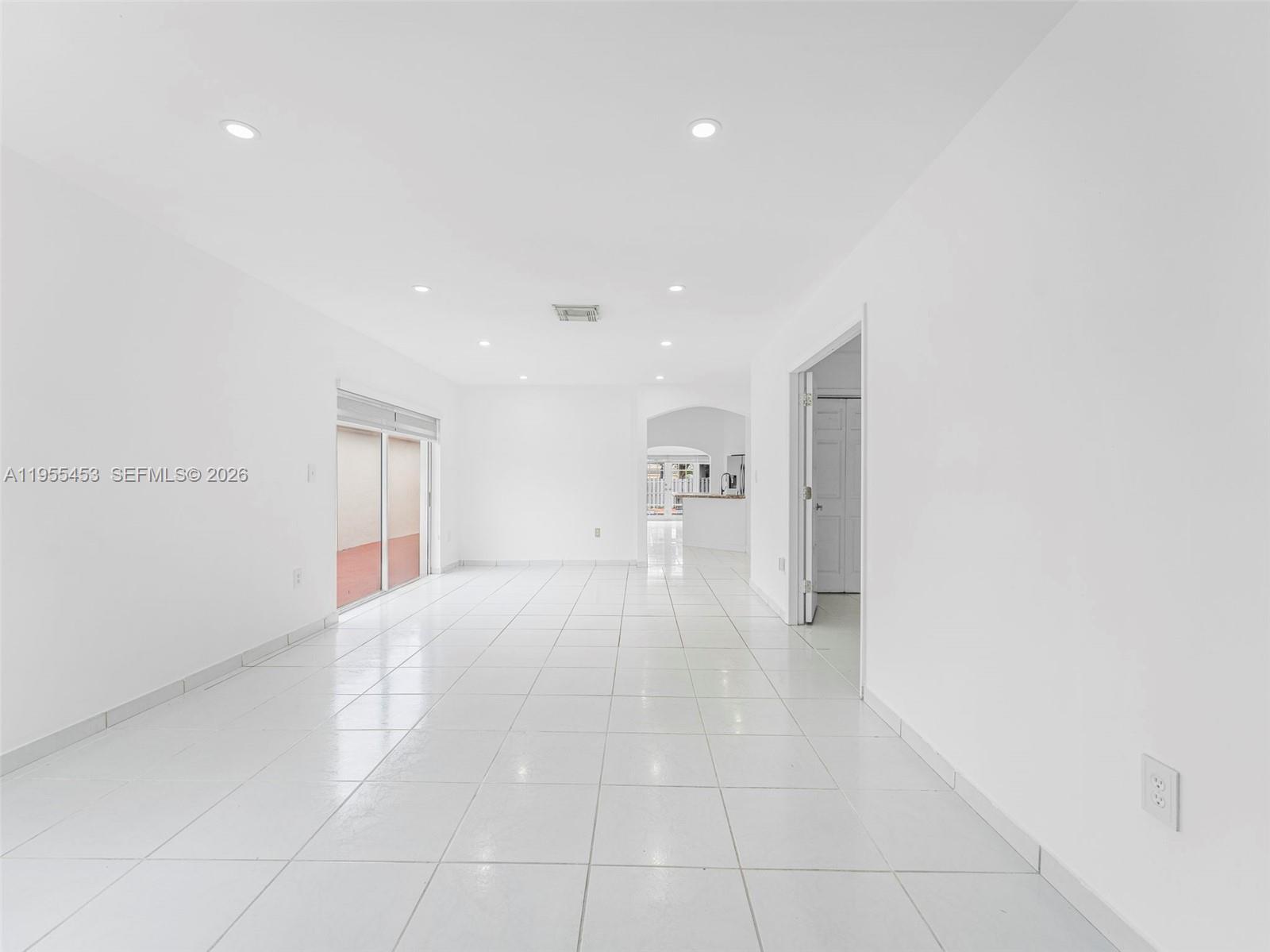 9435 Southwest 156th Place Miami, FL 33196 - Photo 2 of 45 a view of an empty room