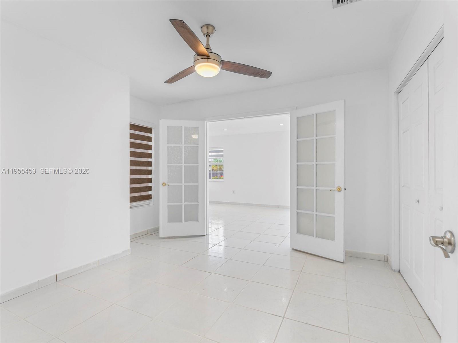 9435 Southwest 156th Place Miami, FL 33196 - Photo 26 of 45 a view of an empty room with a window