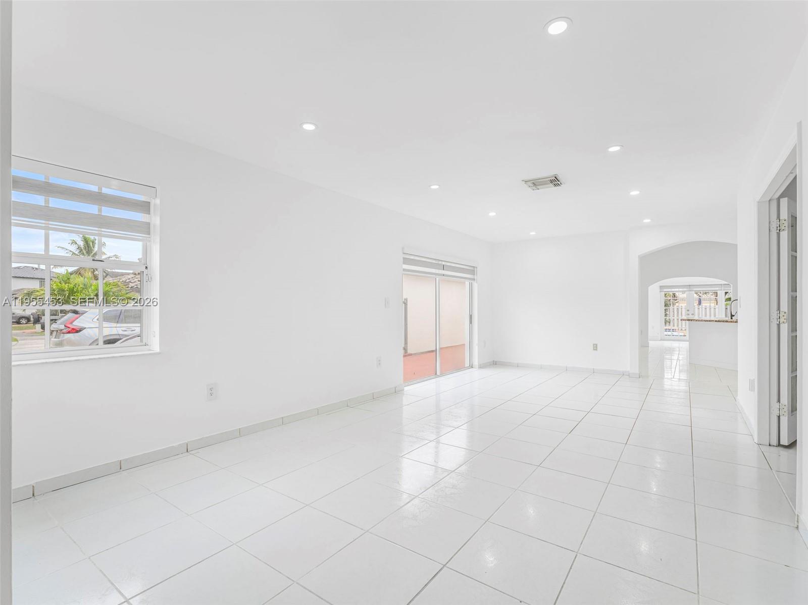 9435 Southwest 156th Place Miami, FL 33196 - Photo 3 of 45 a view of an empty room with a window