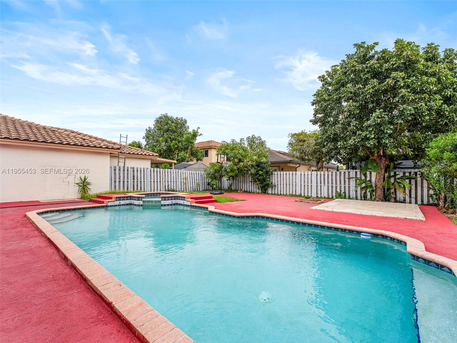 9435 Southwest 156th Place Miami, FL 33196 - Photo 33 of 45 a view of swimming pool with a yard