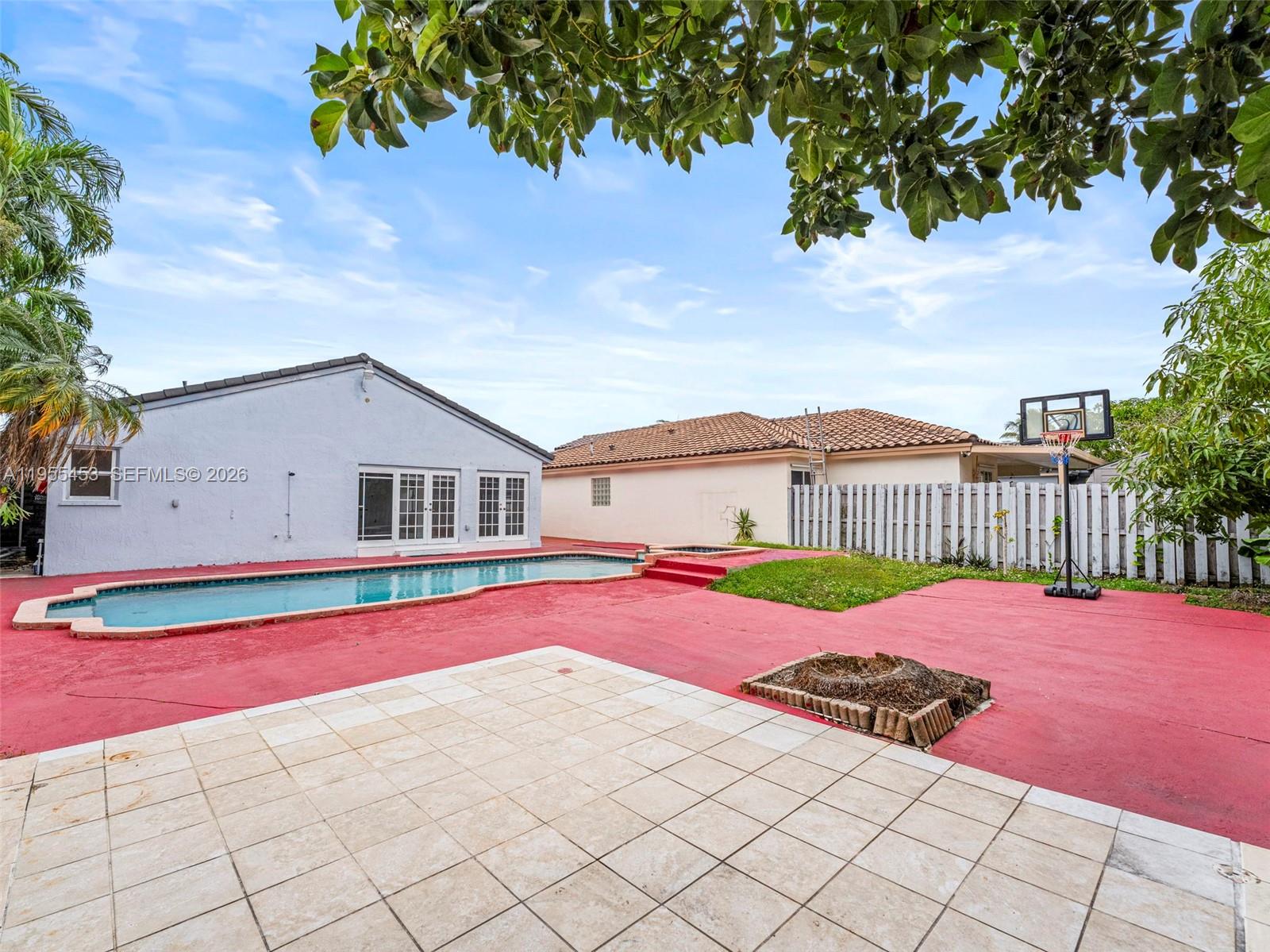 9435 Southwest 156th Place Miami, FL 33196 - Photo 35 of 45 a view of a house with wooden floor and a yard