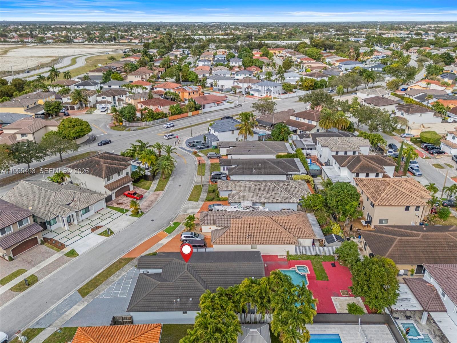 9435 Southwest 156th Place Miami, FL 33196 - Photo 43 of 45 an aerial view of residential houses with outdoor space