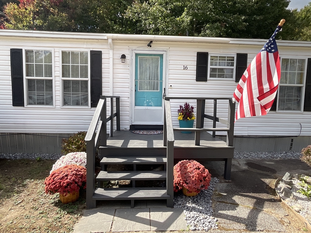 16 Agent Road Raymond, NH 03077 - Photo 1 of 35 a view of a two chairs and a potted plants