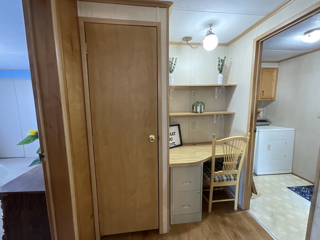 16 Agent Road Raymond, NH 03077 - Photo 14 of 35 a view of dining room with wooden floor and cabinets