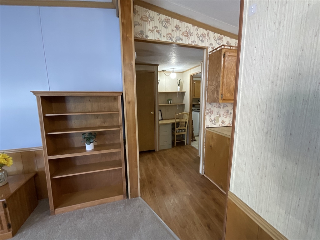 16 Agent Road Raymond, NH 03077 - Photo 17 of 35 a view of walk in closet with empty racks