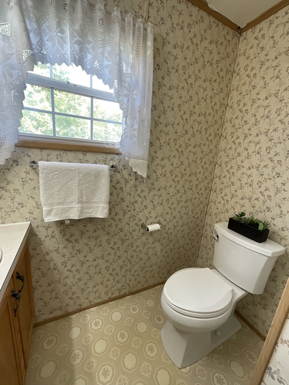 16 Agent Road Raymond, NH 03077 - Photo 24 of 35 a white toilet sitting next to a shower