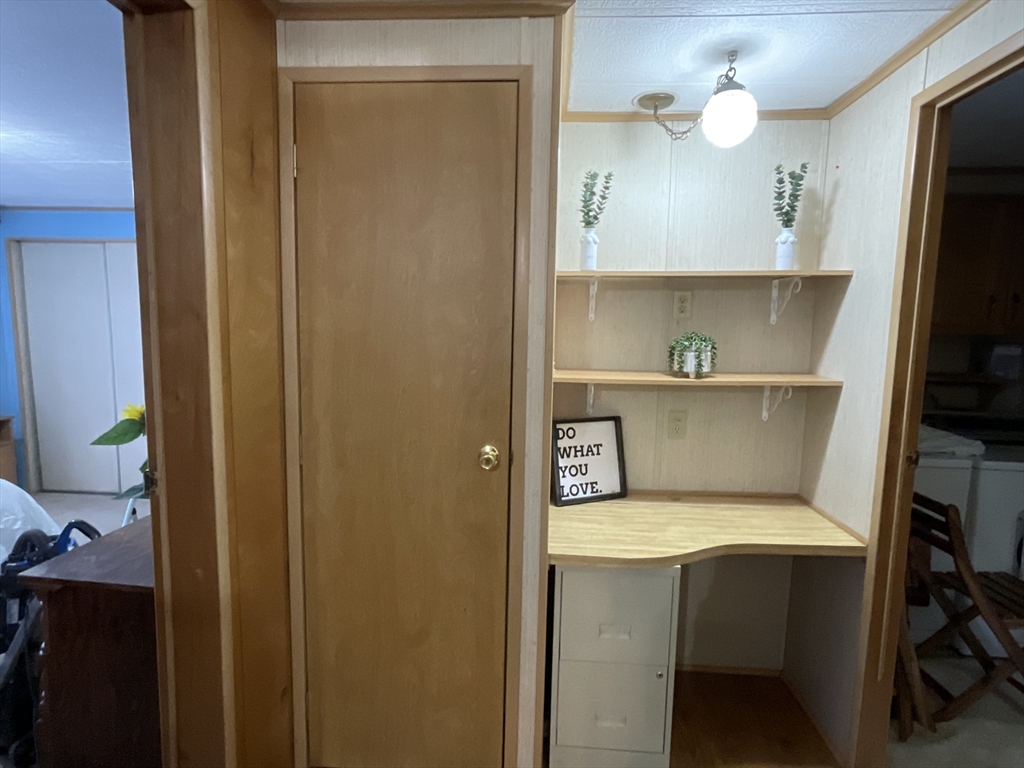 16 Agent Road Raymond, NH 03077 - Photo 31 of 35 a kitchen with a refrigerator and a sink