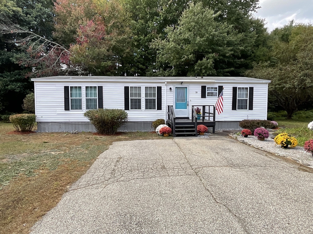 16 Agent Road Raymond, NH 03077 - Photo 4 of 35 a view of a house with a patio