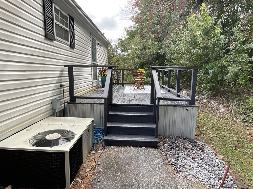 16 Agent Road Raymond, NH 03077 - Photo 5 of 35 a view of backyard with deck and outdoor seating