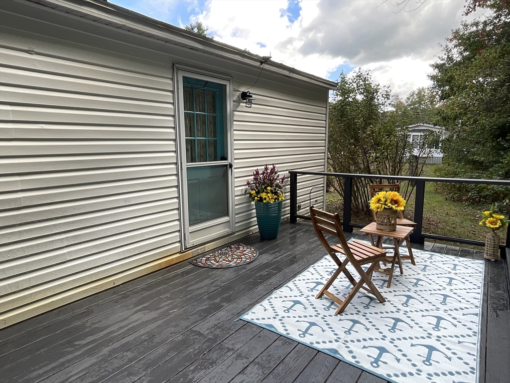16 Agent Road Raymond, NH 03077 - Photo 6 of 35 a deck view with a seating space
