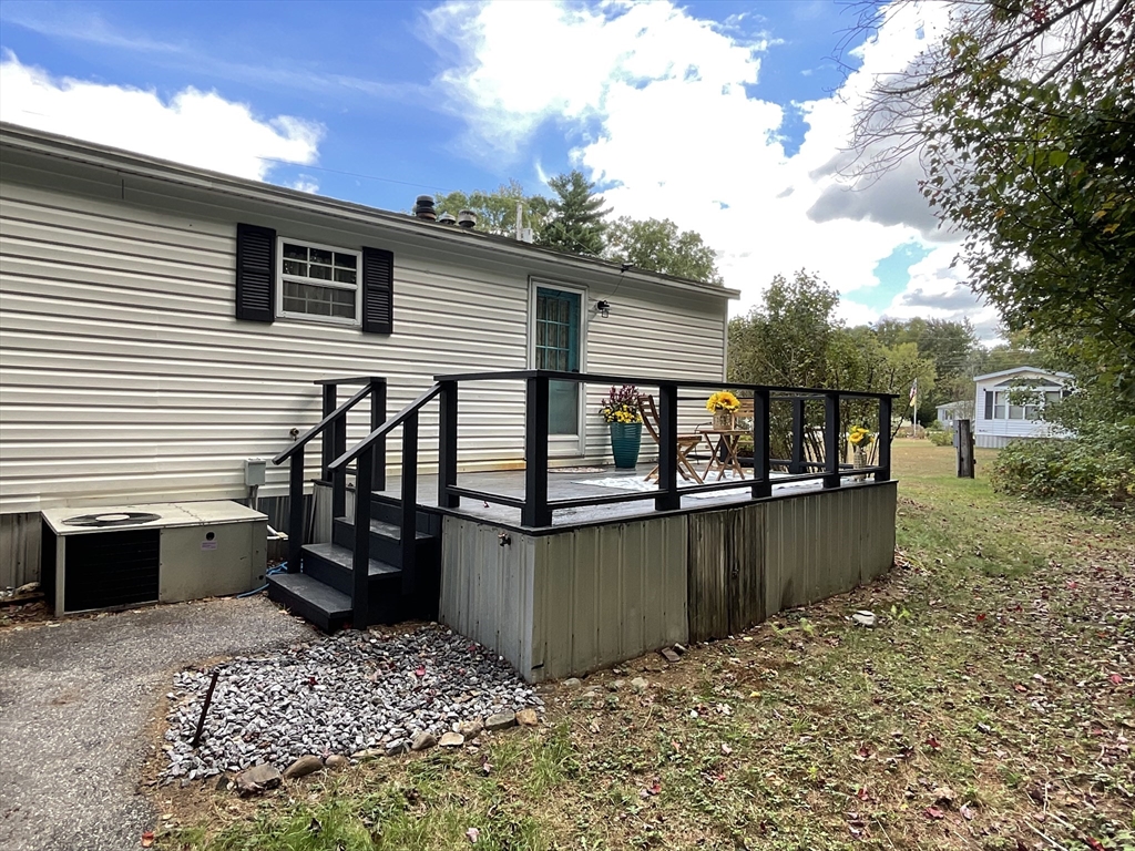 16 Agent Road Raymond, NH 03077 - Photo 7 of 35 a view of a terrace with chairs