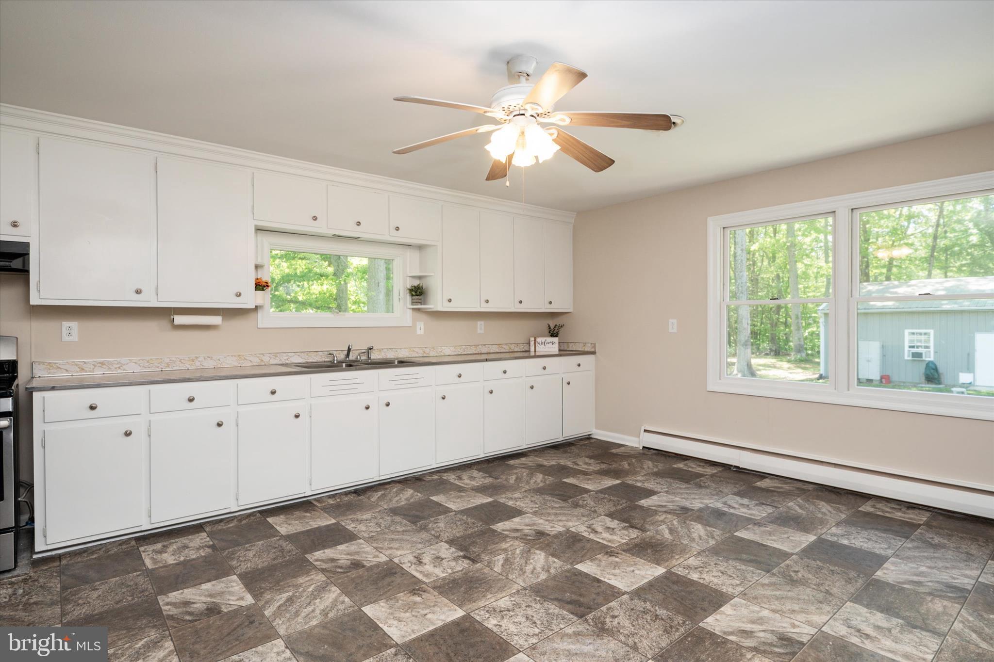 117 Rebel Road Grasonville, MD 21638 - Photo 10 of 46 Freshly Painted Cabinetry in Expansive Kitchen