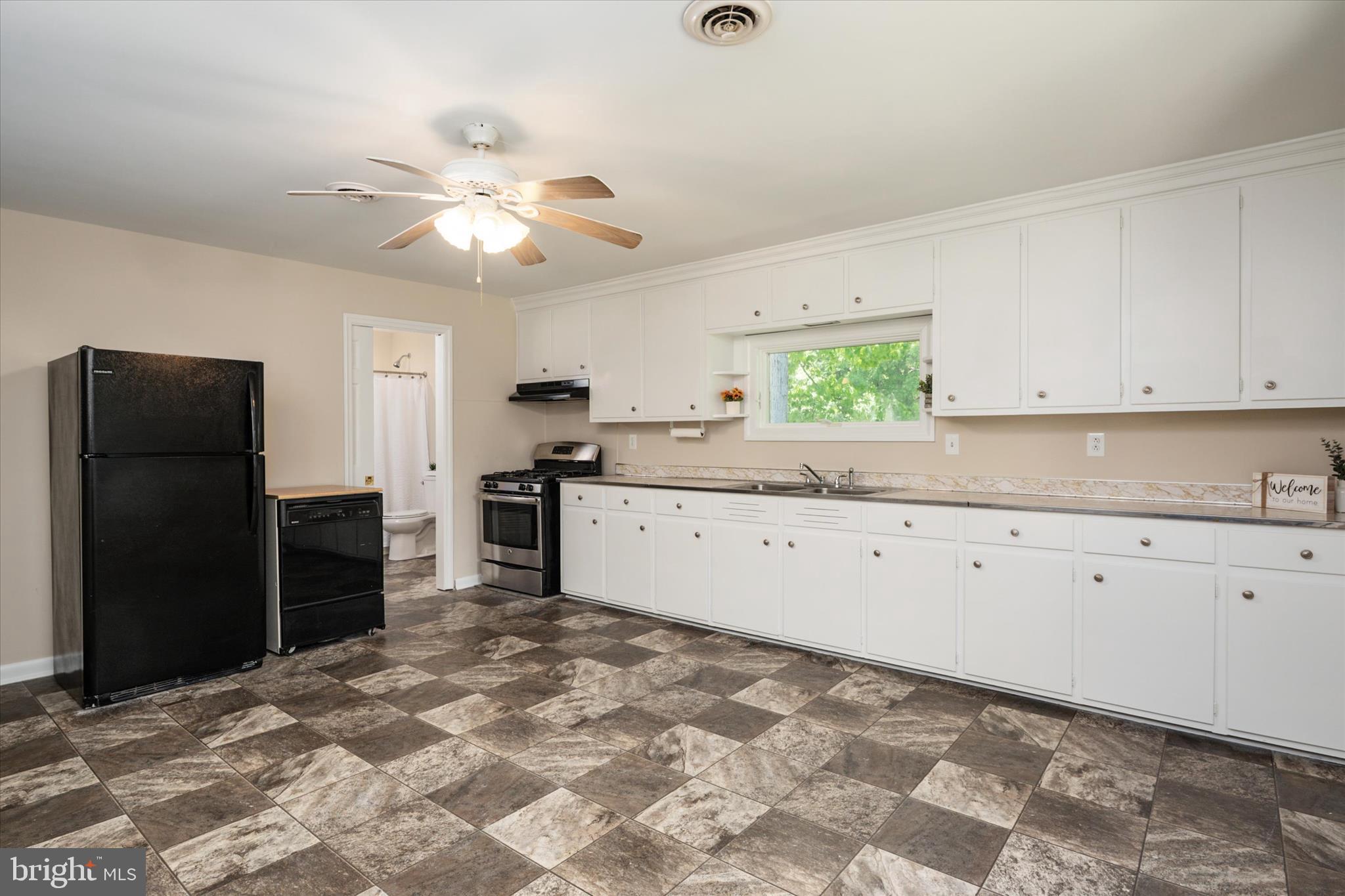 117 Rebel Road Grasonville, MD 21638 - Photo 11 of 46 Freshly Painted Cabinetry in Expansive Kitchen