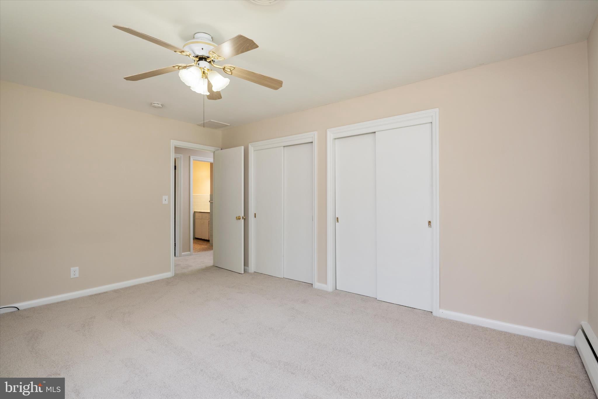 117 Rebel Road Grasonville, MD 21638 - Photo 15 of 46 Primary bedroom w/ dual closets- new paint+carpet