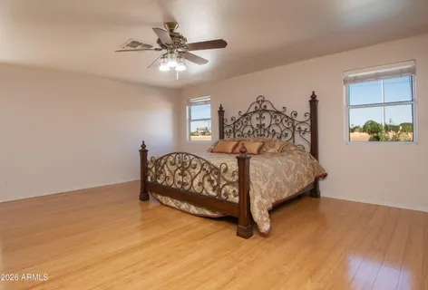 a bedroom with a bed and window