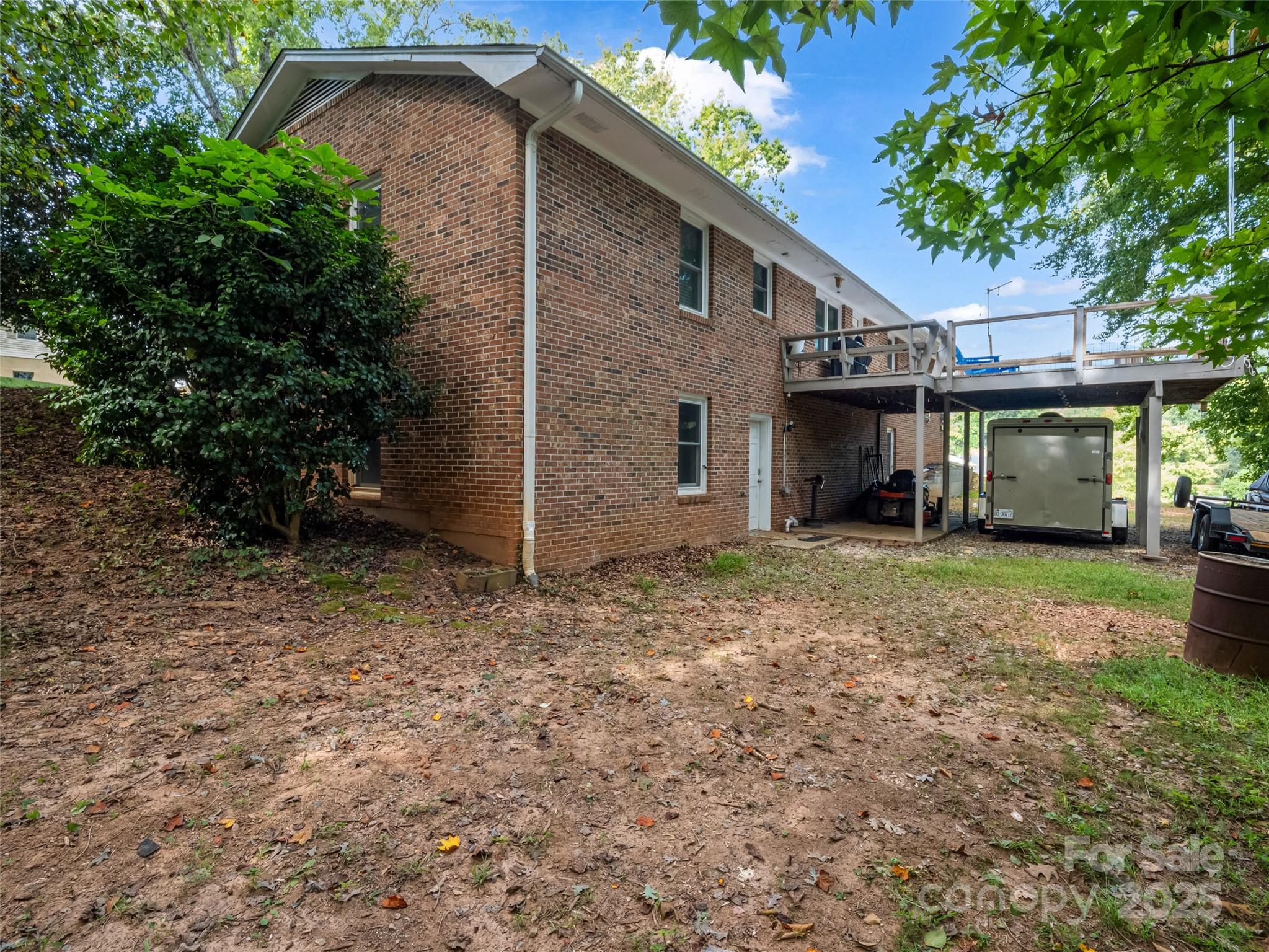 263 Blanton Street Columbus, NC 28722 - Photo 7 of 45 a view of a house with a yard