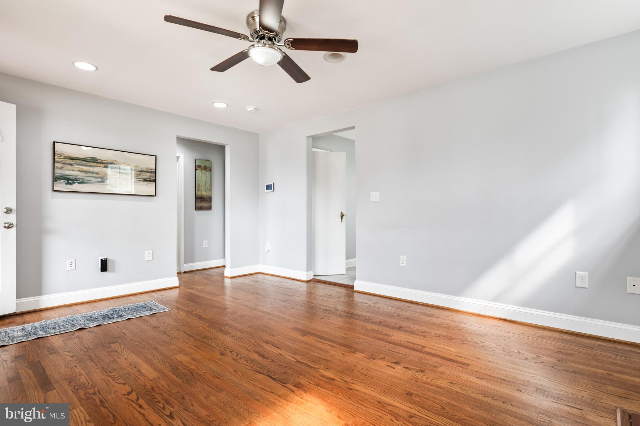 4416 Fullerton Avenue Nottingham, MD 21236 - Photo 11 of 70 an empty room with wooden floor and windows