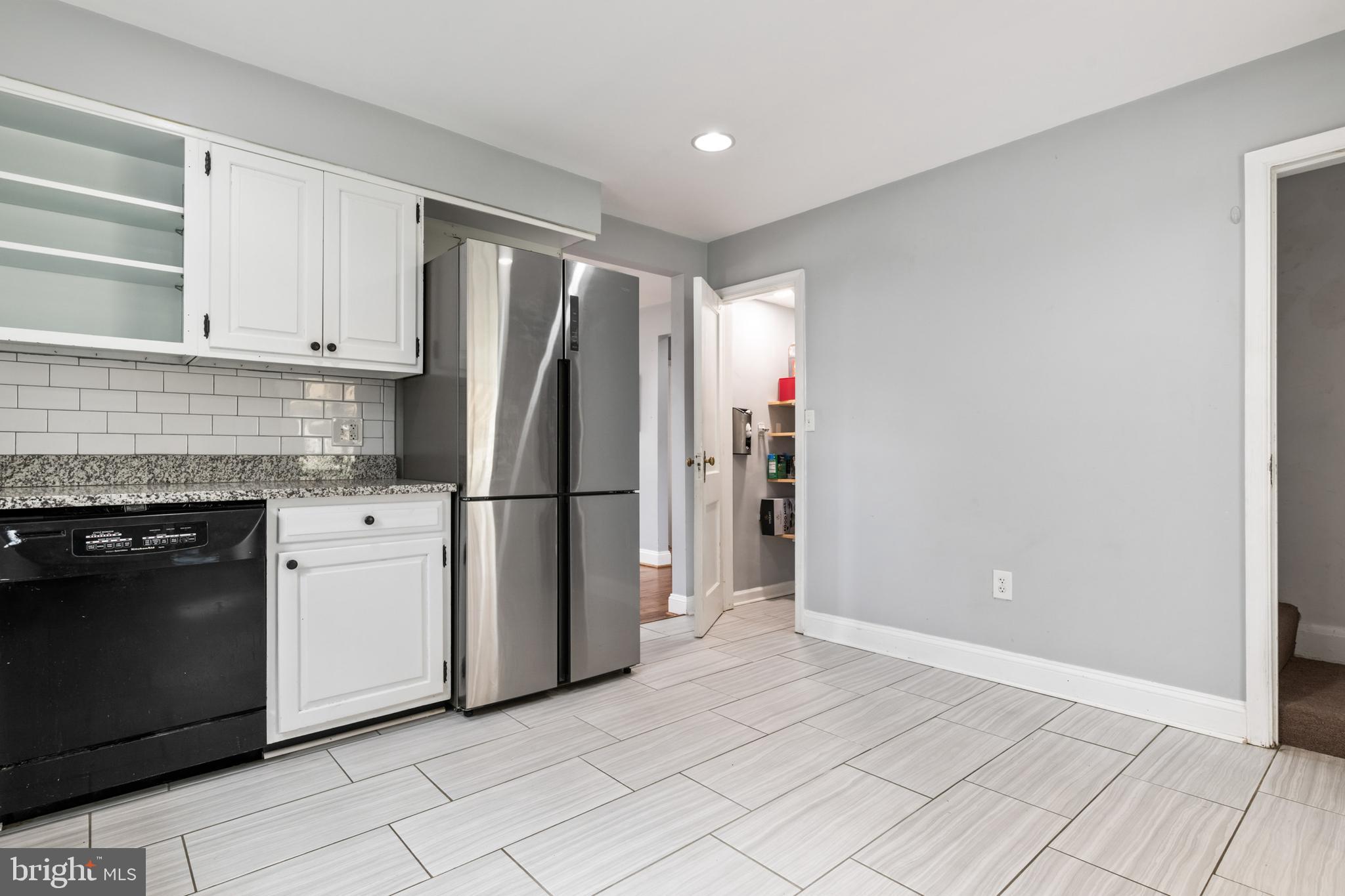4416 Fullerton Avenue Nottingham, MD 21236 - Photo 15 of 70 a kitchen with stainless steel appliances granite countertop a refrigerator and a stove top oven