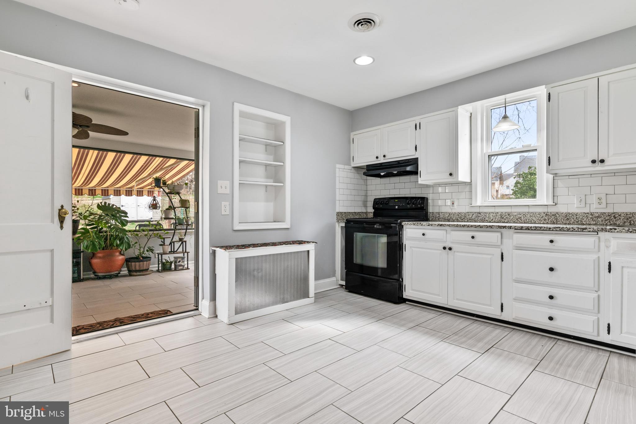 4416 Fullerton Avenue Nottingham, MD 21236 - Photo 16 of 70 a kitchen with granite countertop a stove a sink and a refrigerator