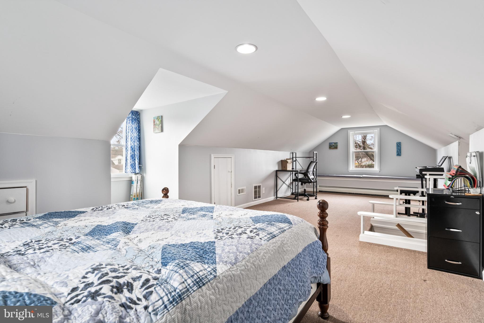 4416 Fullerton Avenue Nottingham, MD 21236 - Photo 24 of 70 a spacious bedroom with a bed a dresser and large windows