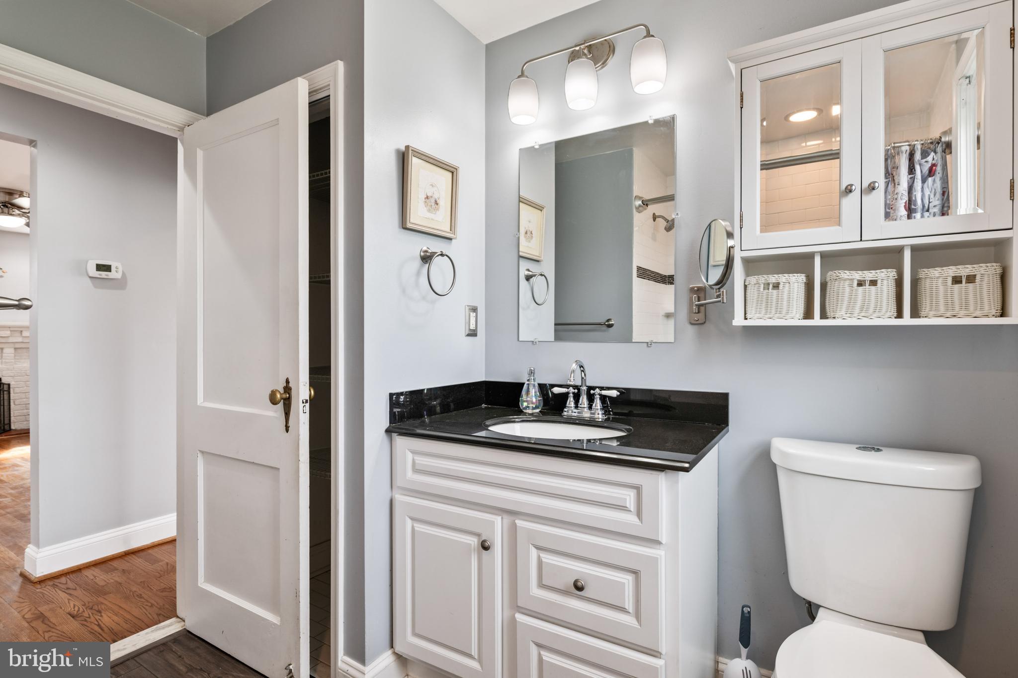 4416 Fullerton Avenue Nottingham, MD 21236 - Photo 32 of 70 a bathroom with a toilet sink and mirror