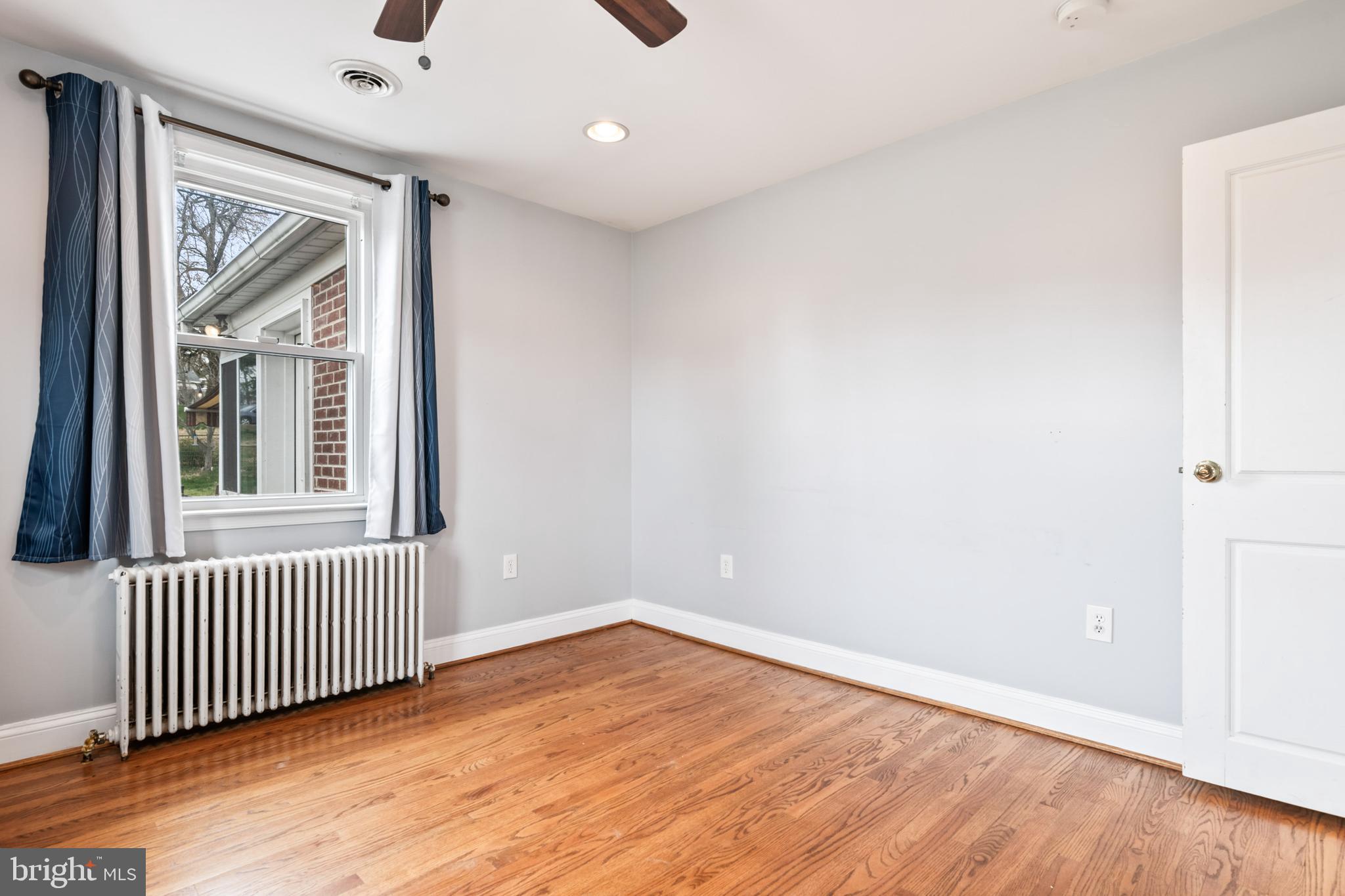 4416 Fullerton Avenue Nottingham, MD 21236 - Photo 36 of 70 an empty room with wooden floor and windows