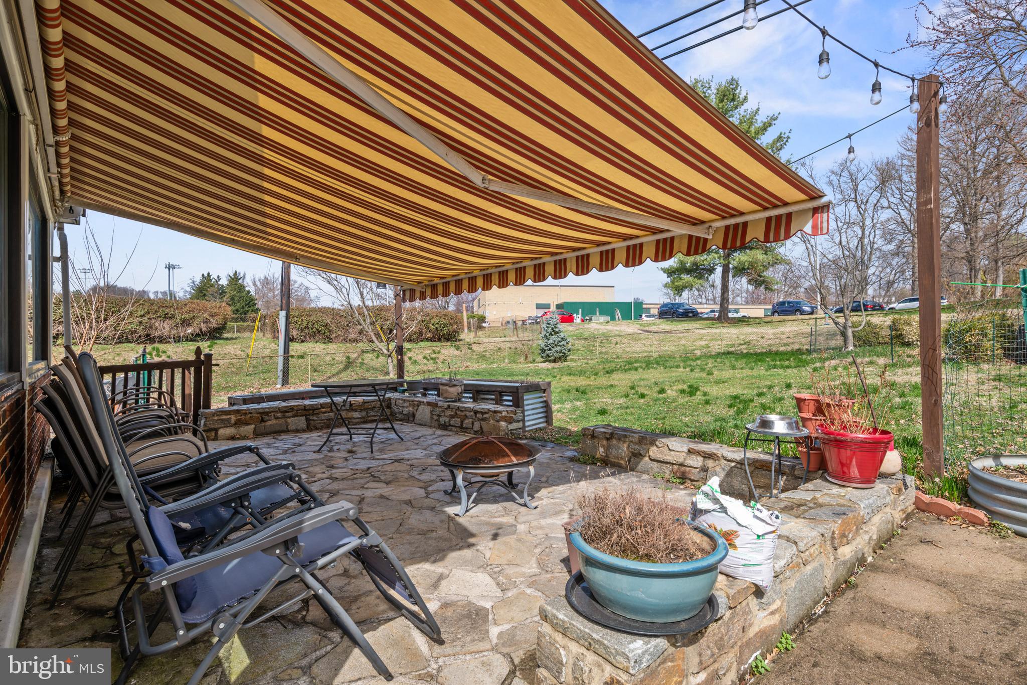 4416 Fullerton Avenue Nottingham, MD 21236 - Photo 51 of 70 a patio with a table and chairs and potted plants