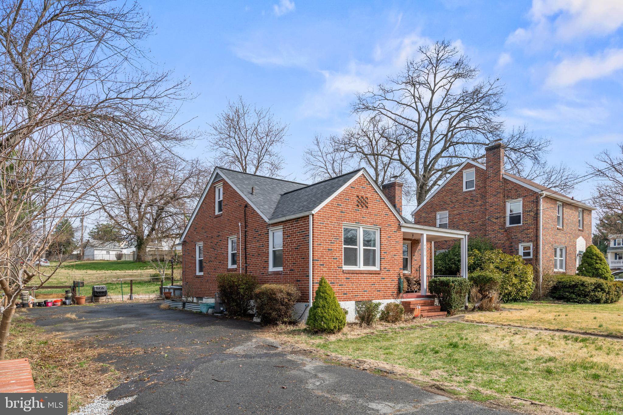 4416 Fullerton Avenue Nottingham, MD 21236 - Photo 65 of 70 a front view of a house with a yard and garage